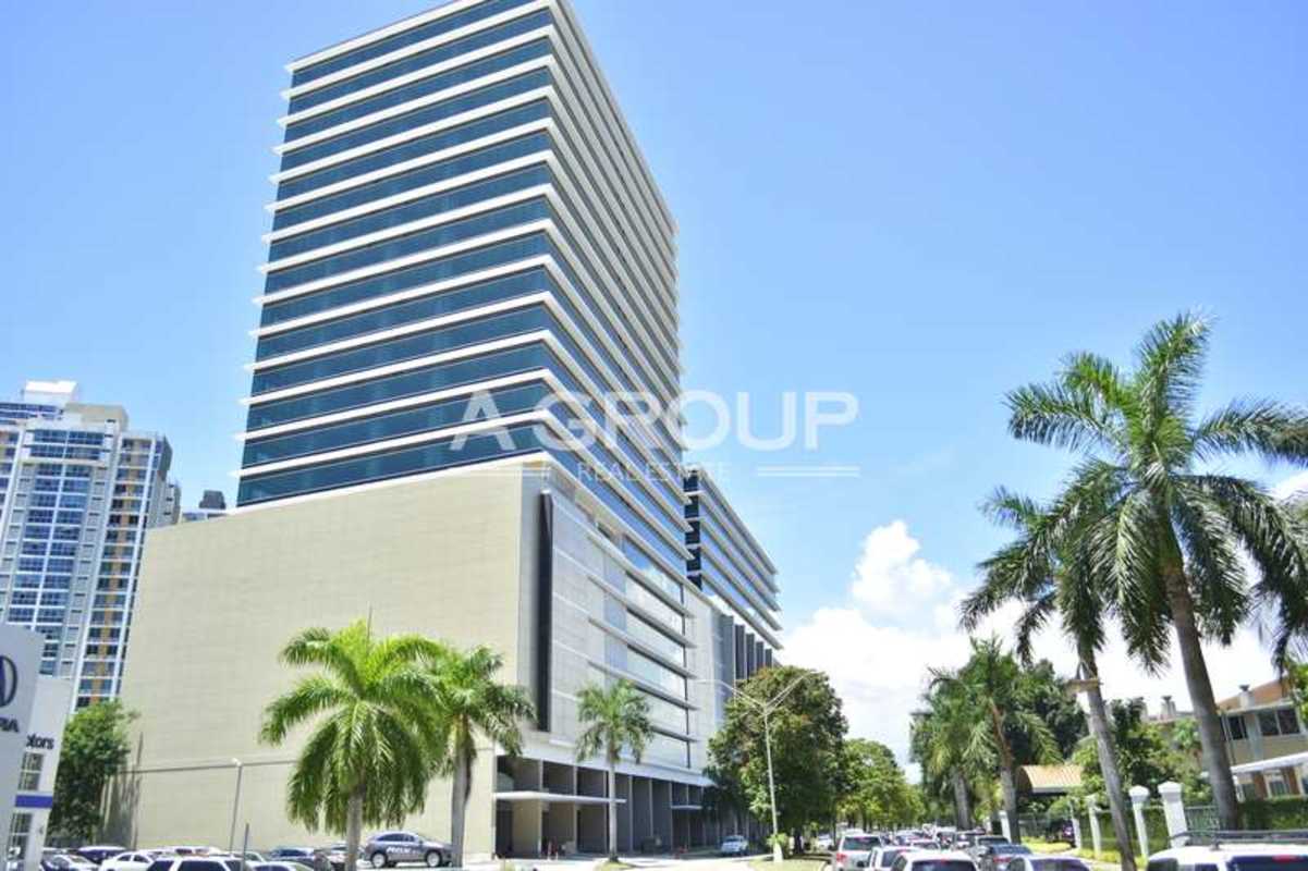 Modern elegant lobby with marble floor, glass turnstiles, reception desk, and lighting in Financial Park Panama