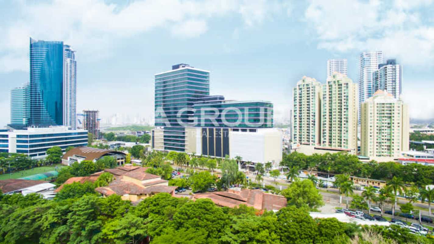 Aerial of multiple glass tower skyscrapers and city skyline in Costa del Este Panama.