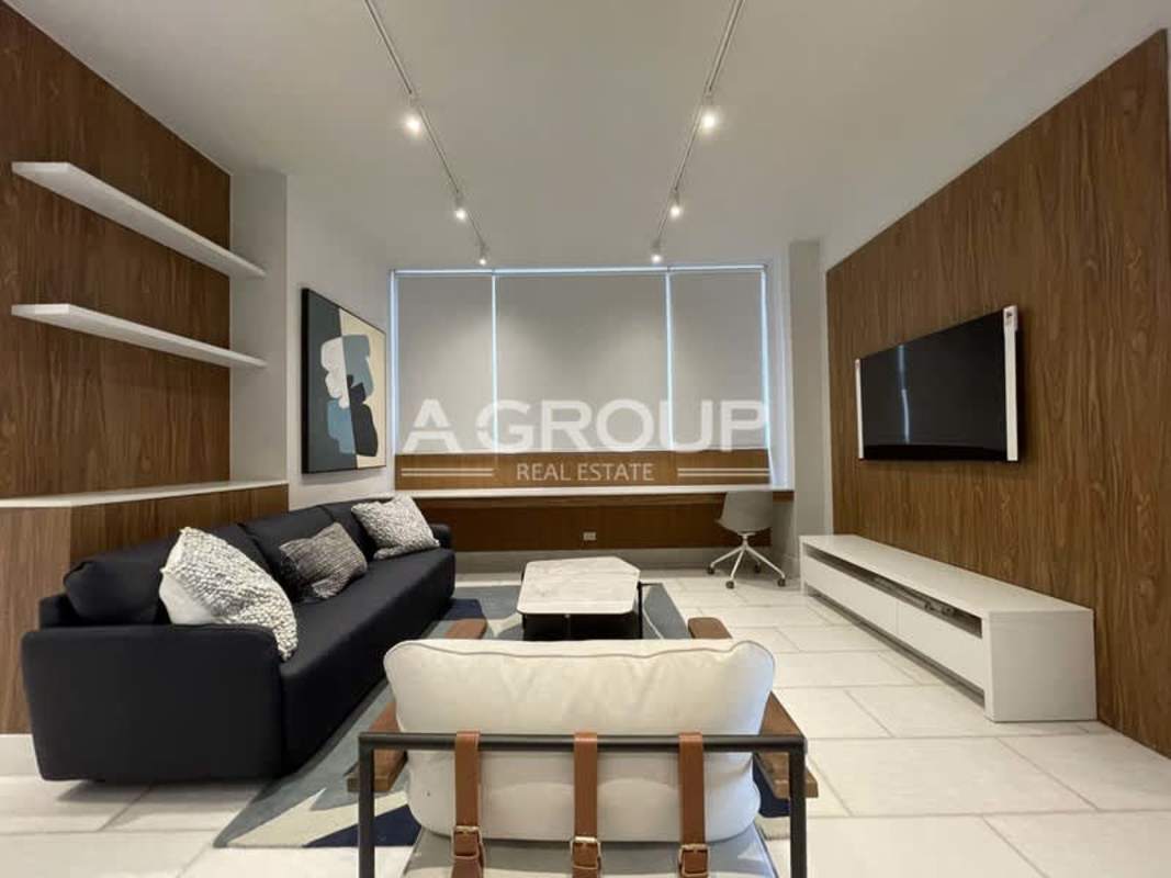 Luxury dining and living room area with panoramic windows, marble floors at The Towers Punta Paitilla Panama