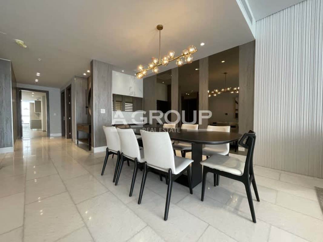 Contemporary luxury dining area with marble floors, chandelier and modern decor at The Towers Panama