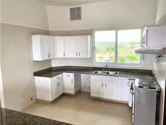 Spacious kitchen with granite counters and ceramic floor PH Punta Barco Village Panama
