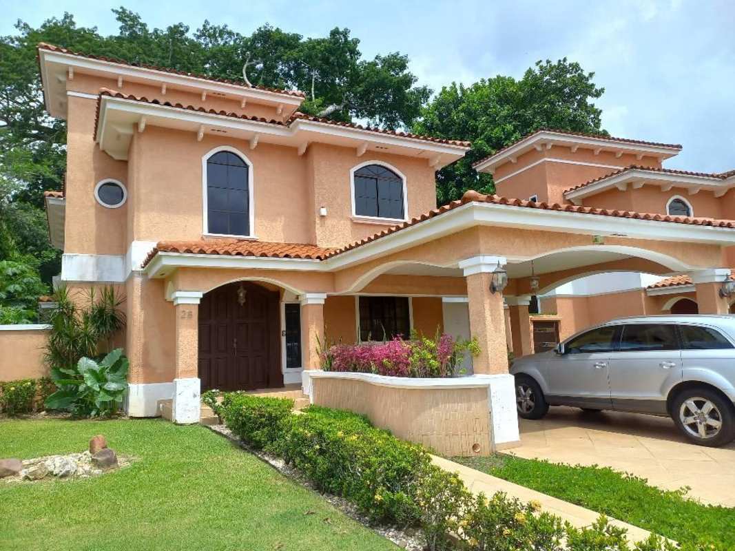 Two-story house with carport and landscaped front garden in Clayton Village Panama