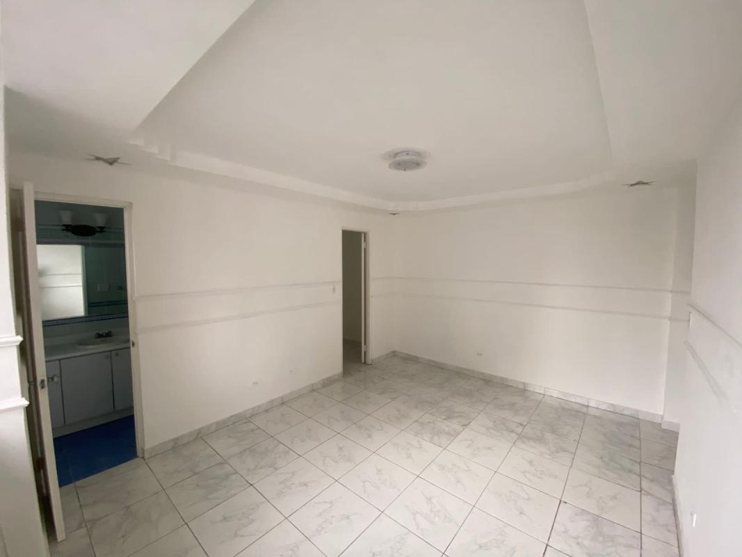 Contemporary white kitchen with granite counters and stainless appliances at PH Costa del Mar