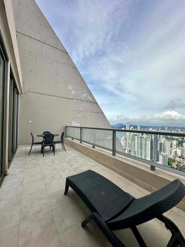 Modern living room with panoramic ocean and skyline view in Punta Pacifica Luxury Apartment