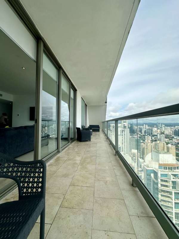 Bedroom with floor-to-ceiling windows and ocean view at Ocean Club Punta Pacifica