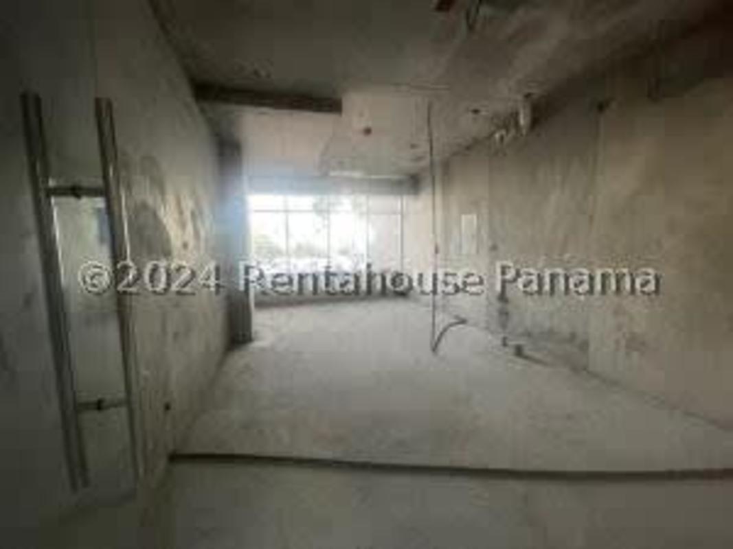 Open shell medical office with concrete walls and large front window in Panama City