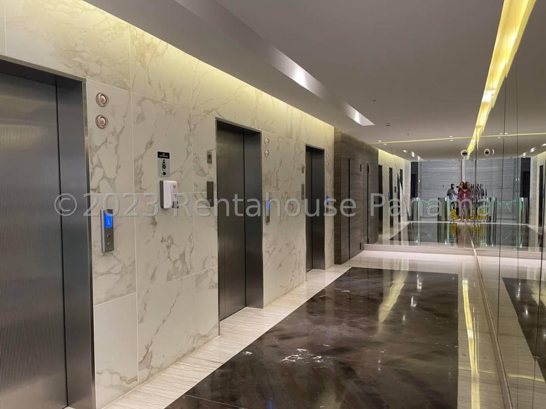 Bright open office area with glass walls and multiple desks PH BICSA Financial Center Panama City