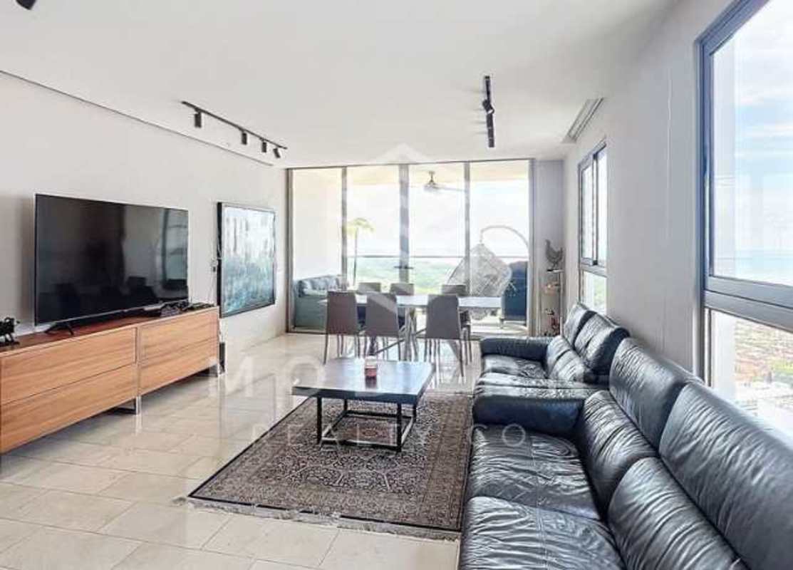 Modern kitchen with island, quartz counters and appliances at PH Greenview Santa María Panama