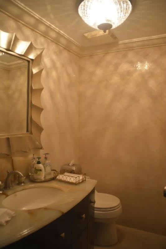 Spacious bathroom featuring granite countertops and walk-in shower at PH Alcazar