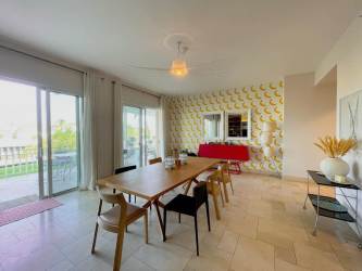 Expansive balcony with dining area and tropical views in Puntarena Buenaventura Panama