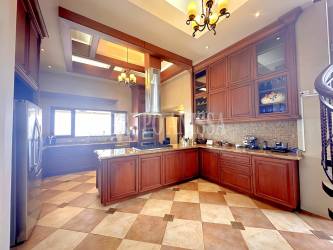 Rustic wine cellar with wood racks storing over 1000 bottles in luxury estate Altos del María Panama