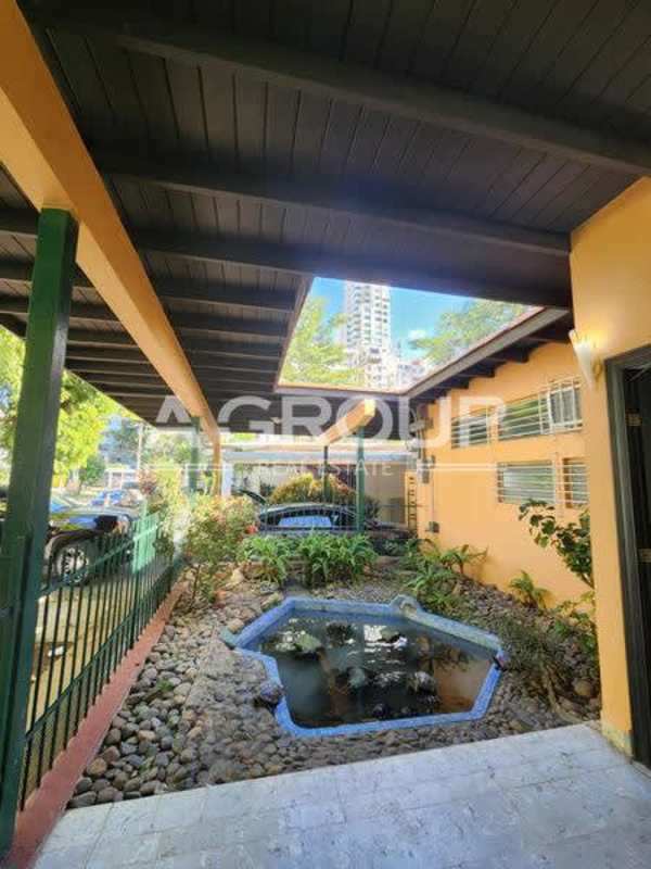 Shaded covered terrace patio with plants in commercial house Marbella Panama