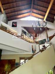 Wood vaulted foyer with staircase and chandelier in beachfront mansion Coronado Panama