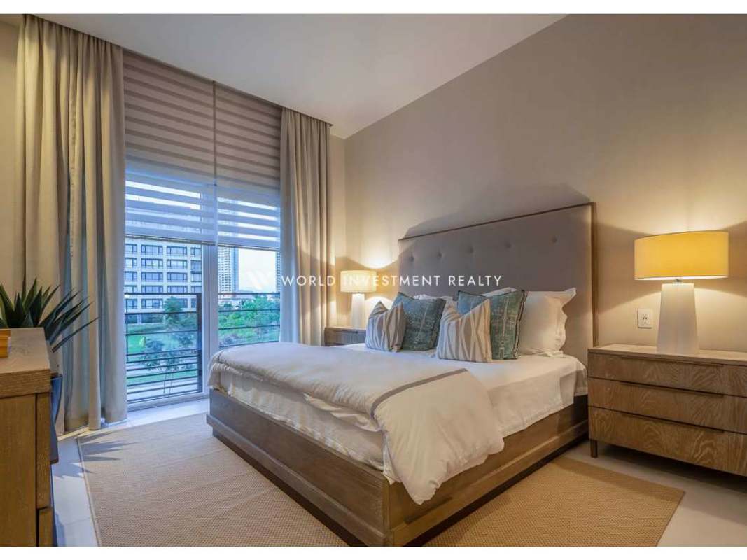 Spacious master bedroom with large window and garden views in The Woods Santa Maria Panama luxury house