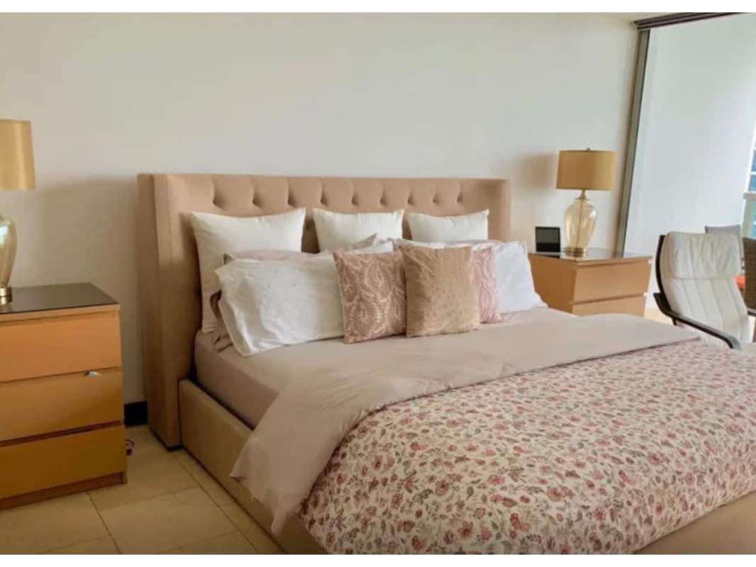 Guest bedroom with built-in closets and skyline views in PH The Ocean Club Punta Pacifica