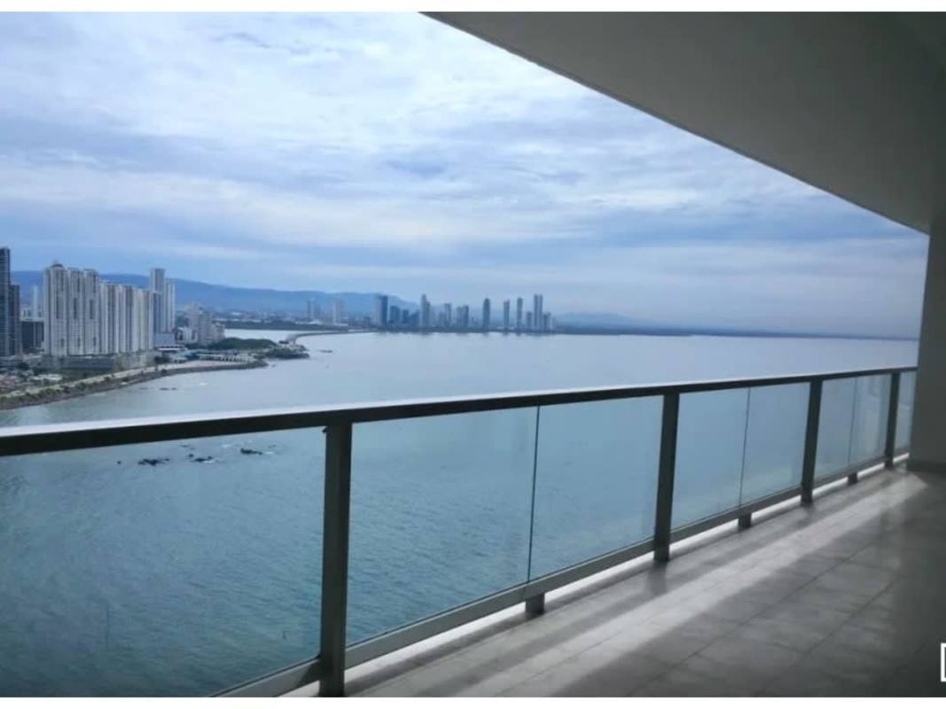Spacious glass balcony with Pacific Ocean and city skyline views at PH The Ocean Club Panama City