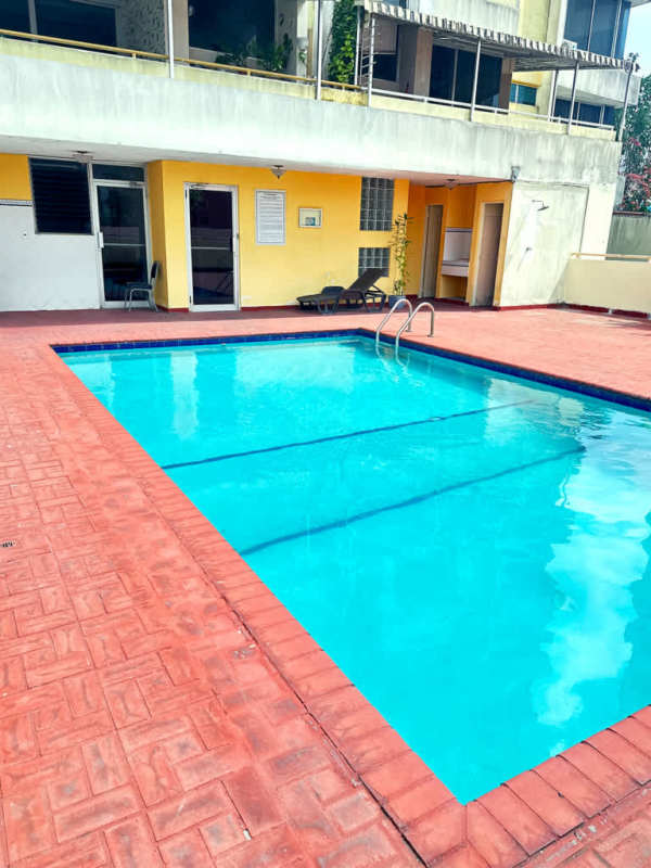 Outdoor pool at PH Villa de las Fuentes with city backdrop in El Dorado Panama