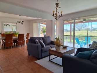 Bright open plan living room with access to covered terrace in townhouse Costa Blanca Villas Decameron Resort Panama