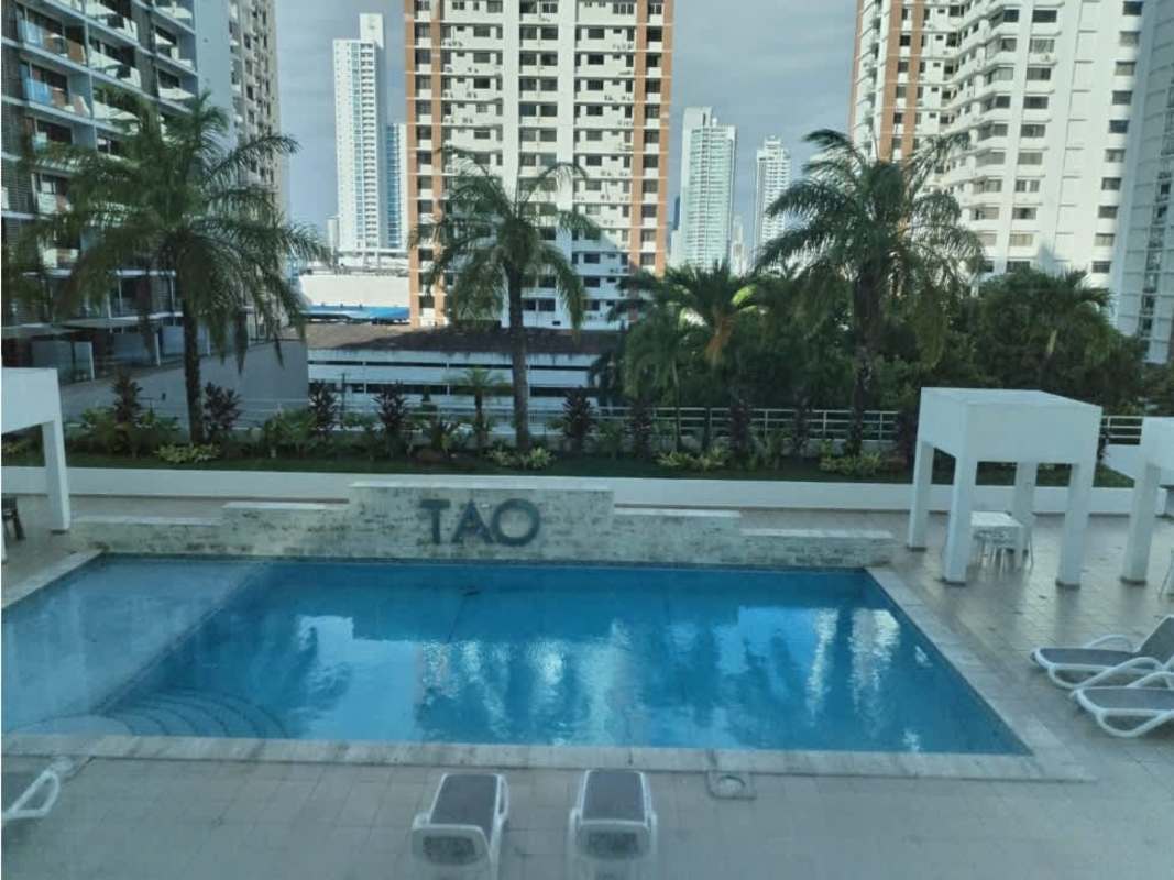 Large living area with floor-to-ceiling windows balcony access at Tao Tower San Francisco Panama