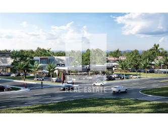 Modern business complex with palm trees, parking, wide roads near Panama property