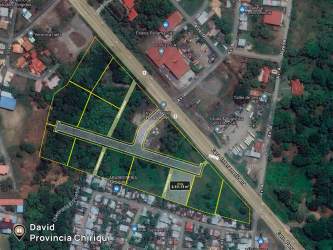 Aerial showing sports courts, green areas and parking near commercial plot in David