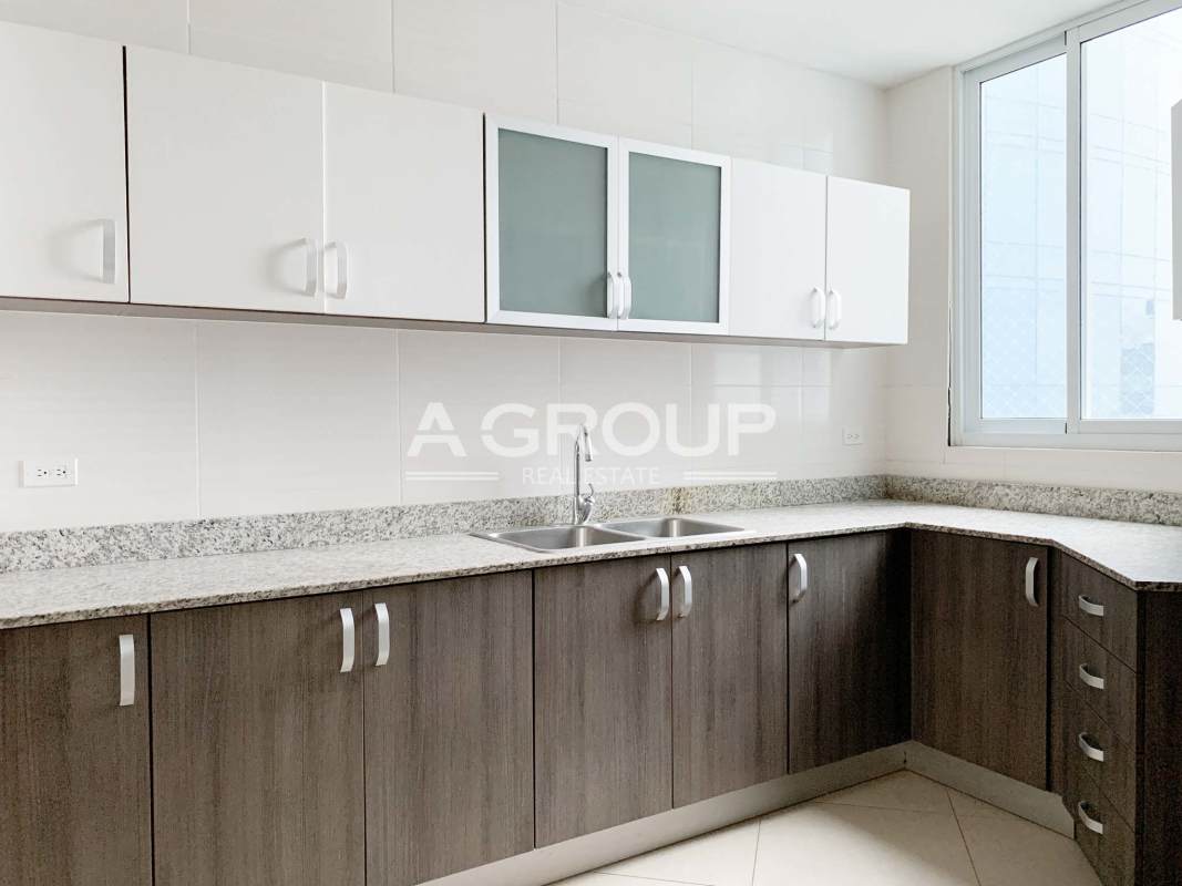 Contemporary bathroom with bathtub and large window city view Costa del Este