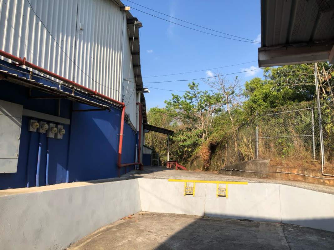 Modern industrial warehouse exterior with blue gray siding in Zona Franca Albrook Panama