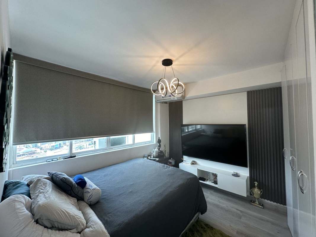 Modern kitchen with granite-style counters and laundry area PH Majestic Garden Edison Panama