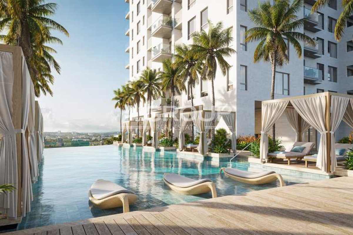 Infinity pool area with shaded cabanas and palm trees at Santa Maria golf community Panama City