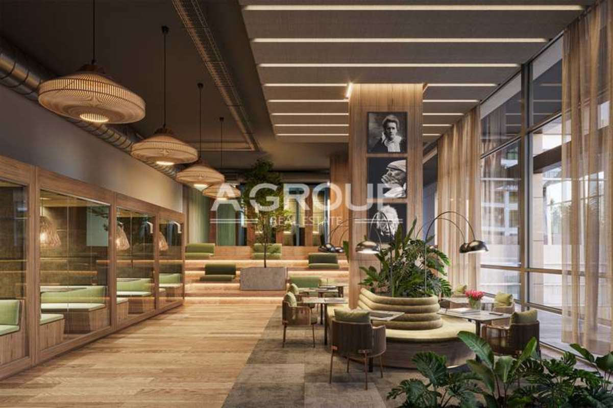 Modern lobby with natural wood accents, plants and glass walls Santa Maria Panama condo