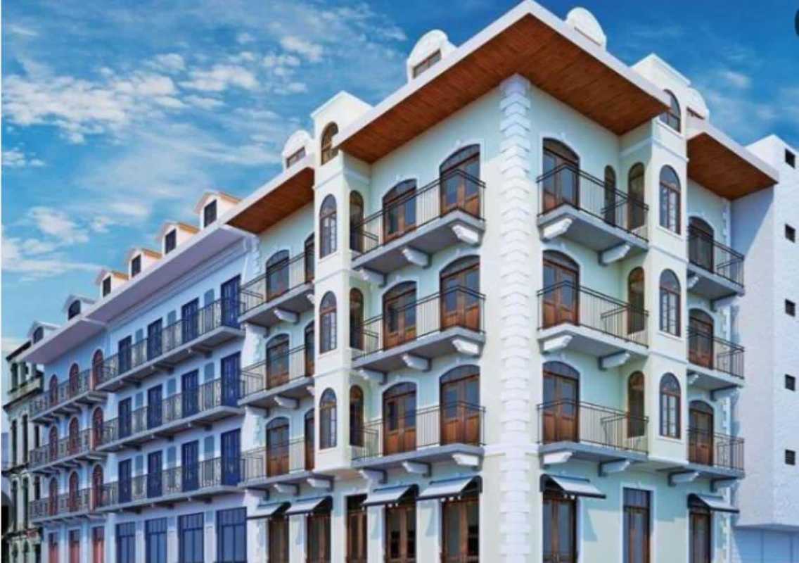 Colonial style facade with balconies, arched windows at PH La Cuadra Casco Viejo Panama