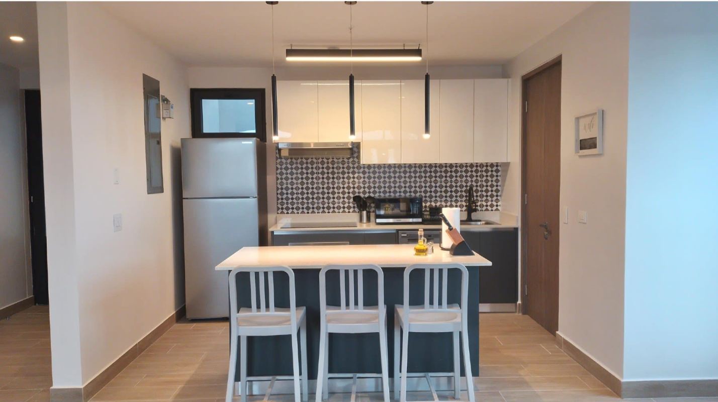 Spacious living dining open plan with accent wall, sofa, large windows PH La Cuadra Casco Viejo Panama