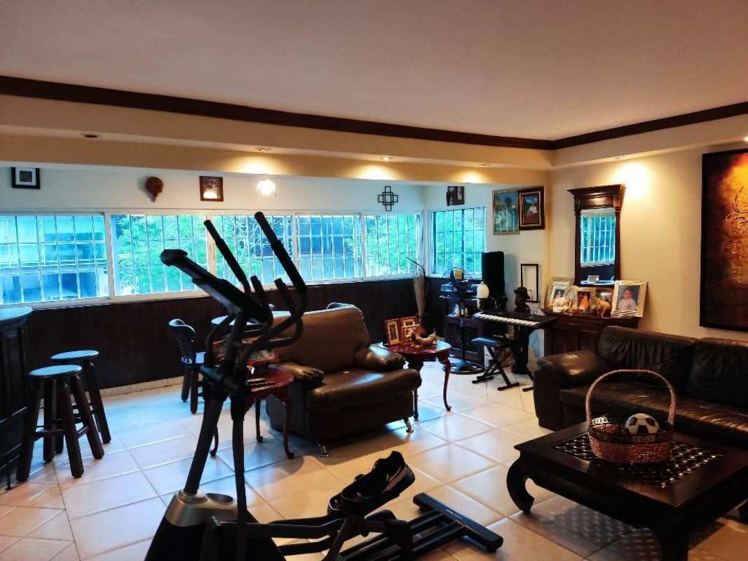 Spacious reception or living area with tile flooring large windows in Panama City mixed-use property