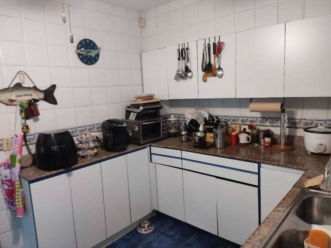 Urban kitchen with built-in appliances, granite countertops, tile backsplash in El Cangrejo Panama