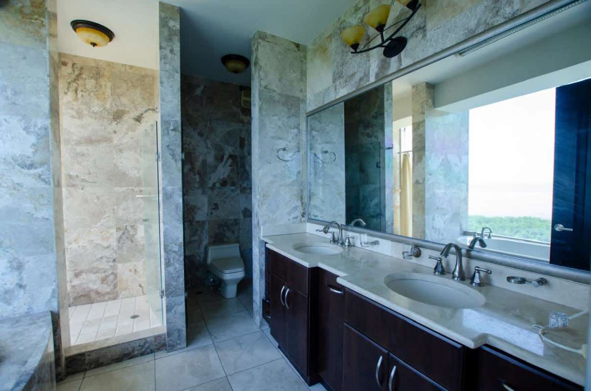 Modern kitchen with granite counters, premium cabinetry, and stainless appliances in PH Ocean Two Costa del Este