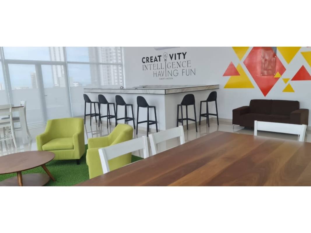 Coworking lounge with seating and bar PH El Botánico Panama