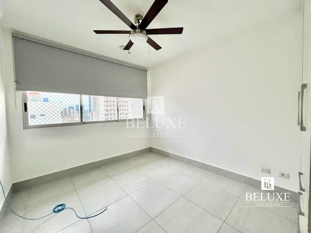 Modern bathroom with glass enclosed shower, vanity mirror and tile finishes PH Jade Tower Panama City