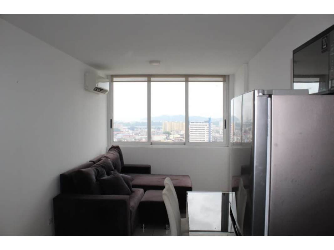 Living dining area with kitchenette and window ocean skyline at PH Bayview Avenida Balboa Panama
