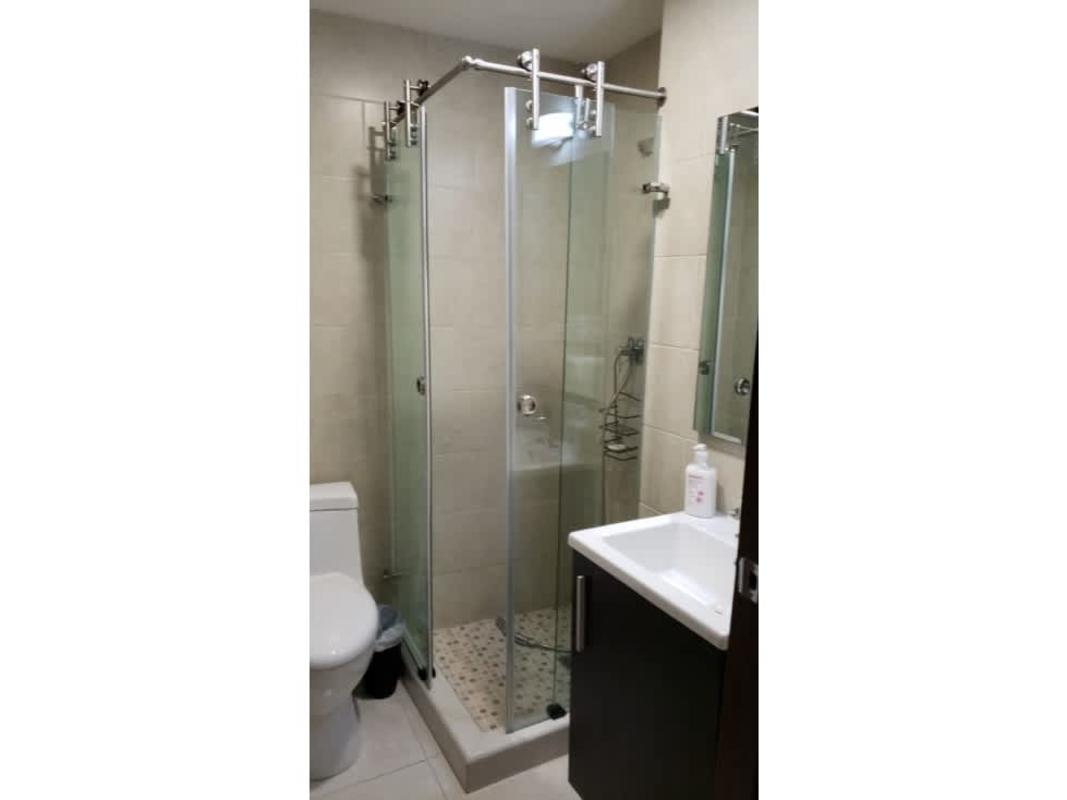 Bathroom with glass shower enclosure sleek design PH Bayview Avenida Balboa Panama