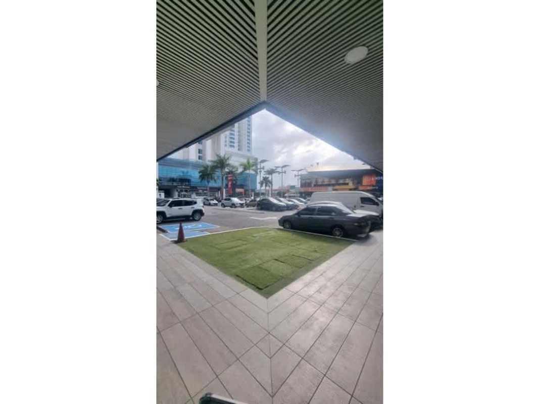 Commercial facility with glass storefronts street view lighting ample open parking space Tocumen Panama