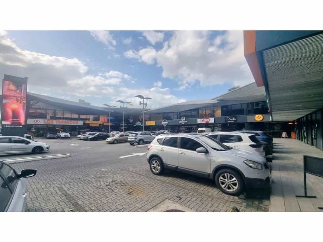 Two-story retail commercial plaza with parking signage landscaping in Panama City Juan Díaz Tocumen