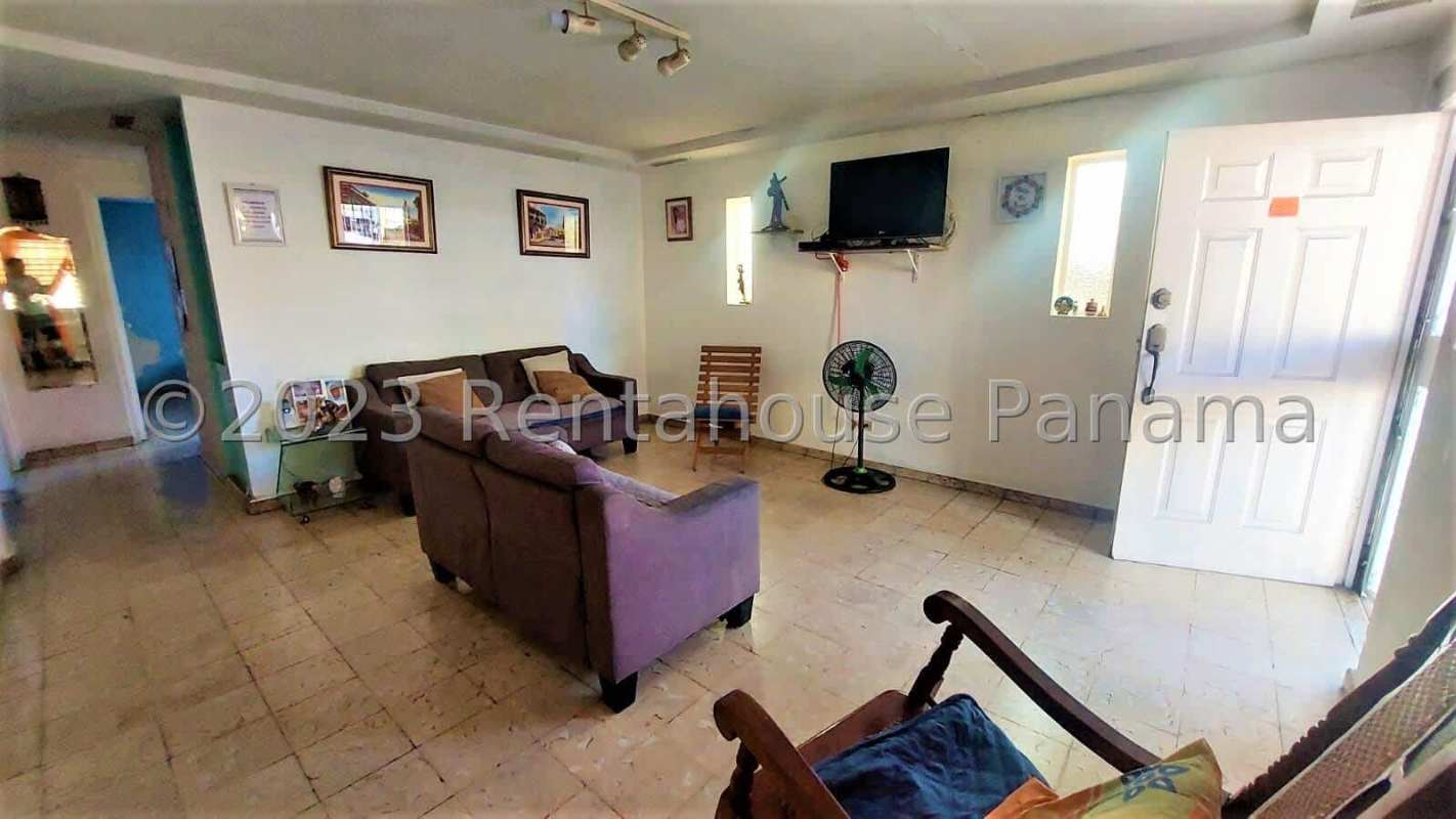 Spacious living and dining room with tile floor and windows at Panama City house in Rio Abajo for sale