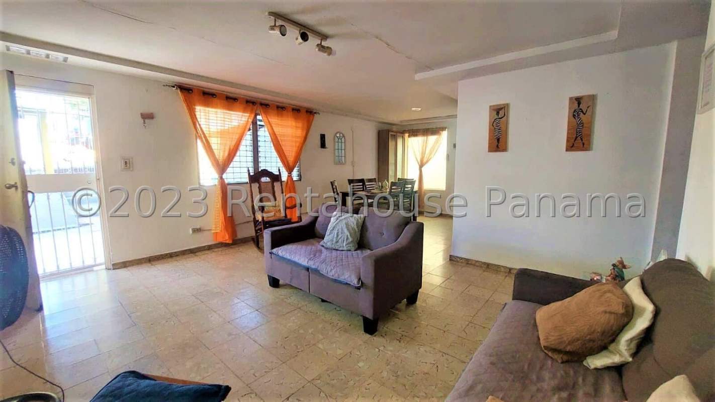 Bedroom with security window bars, natural light, tile floor in house for sale Rio Abajo Panama City