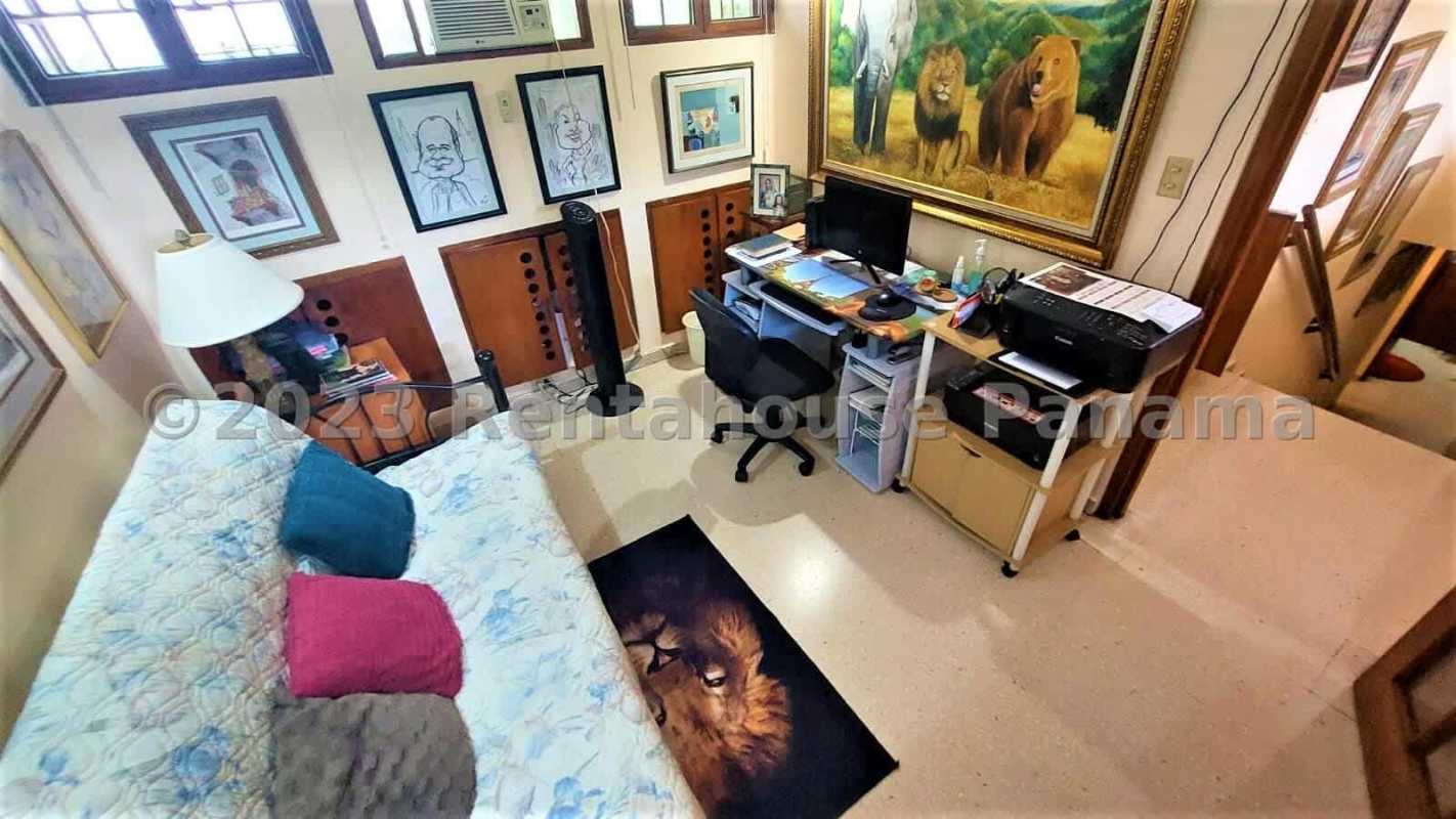 Classical living room with floor-to-ceiling windows, sectional sofa holiday decor La Alameda Panama