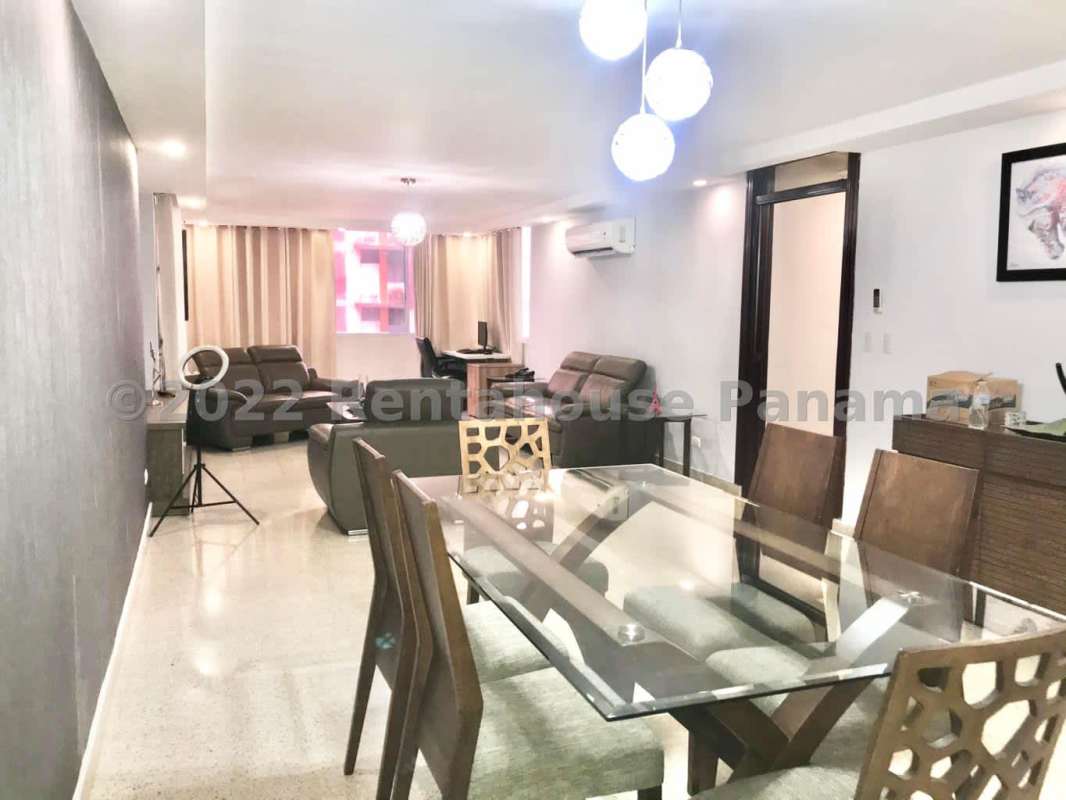 Modern open living and dining space with large windows and AC in PH Fuente de Cibeles Panama