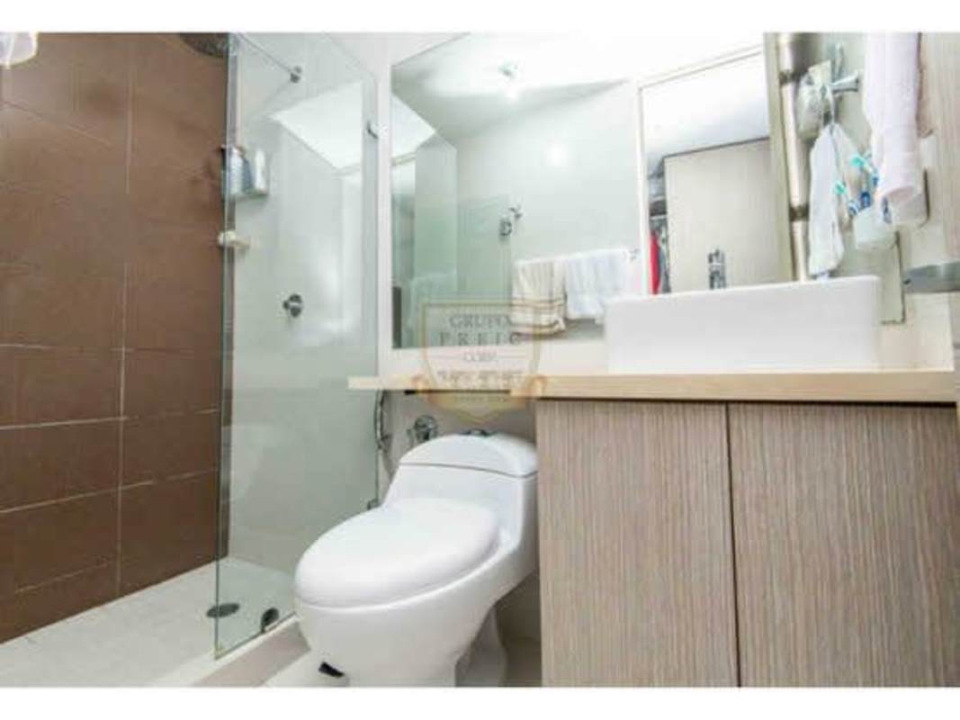 Living room with large window neutral tones Villa Lucre apartment Panama