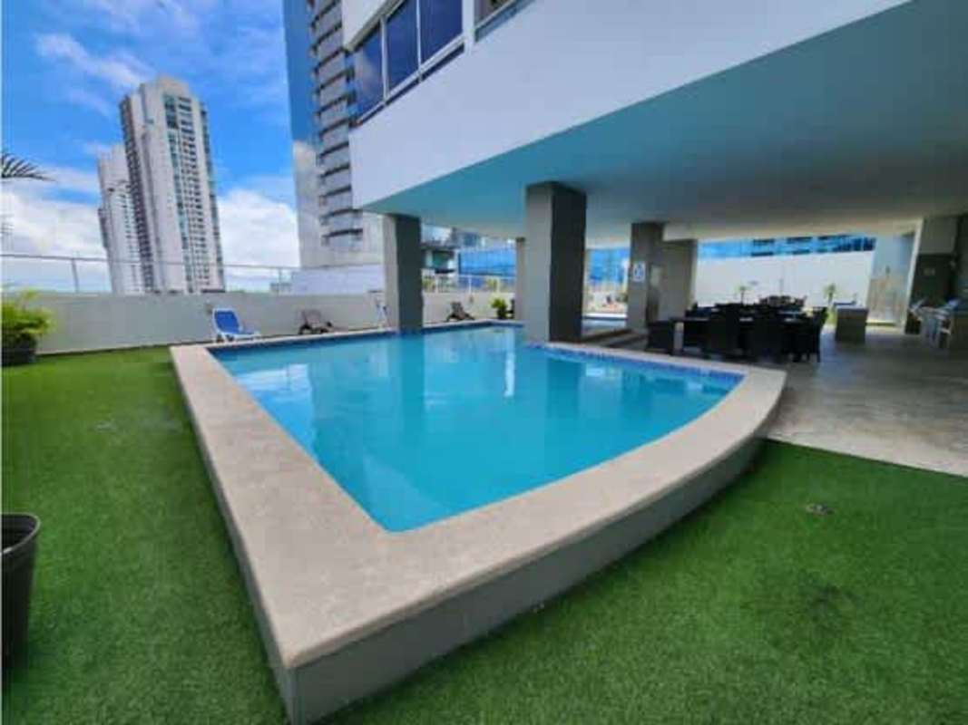 Rooftop pool with lounge chairs and skyline views PH Titanium Tower Costa del Este Panama