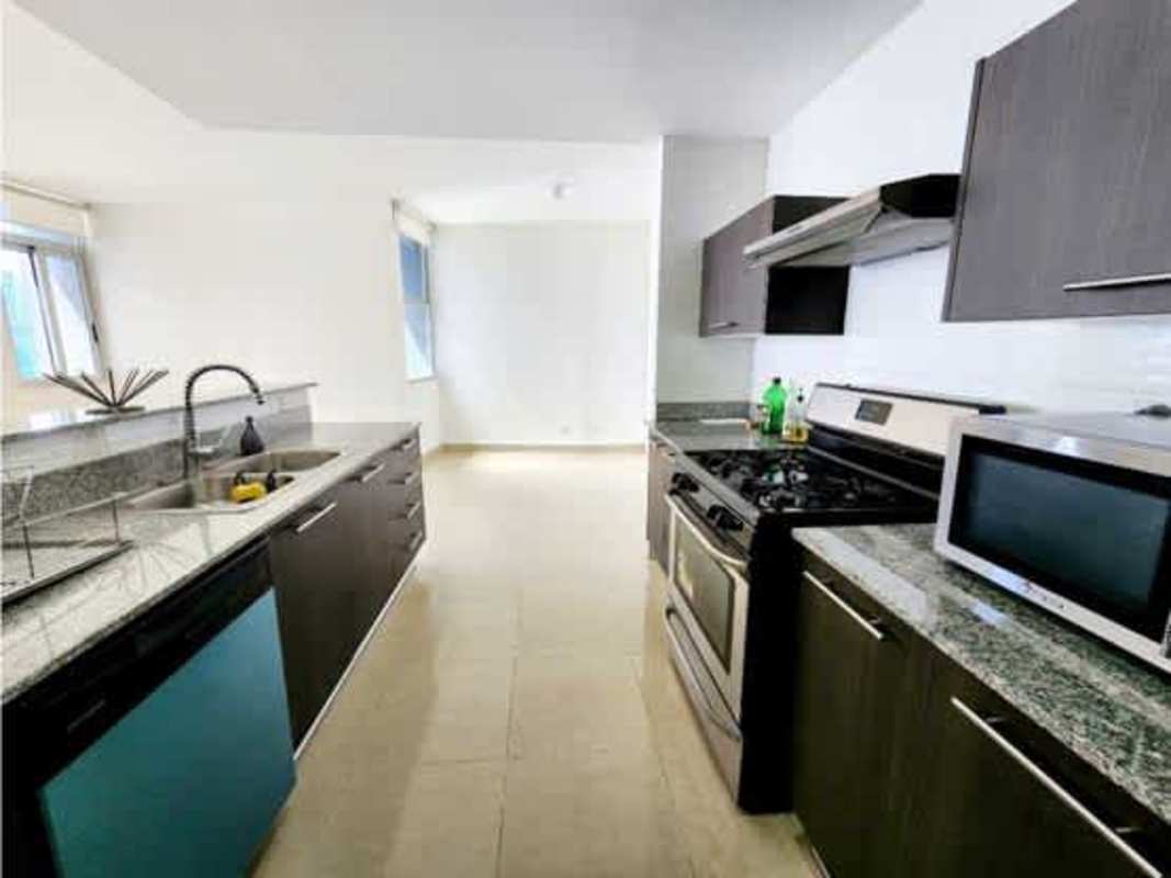 Kitchen with granite counter, double sink, stainless stove PH Titanium Tower Costa del Este