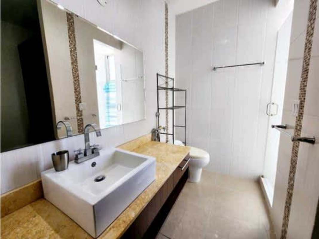 Modern bathroom with granite countertop, glass shower PH Titanium Tower Costa del Este