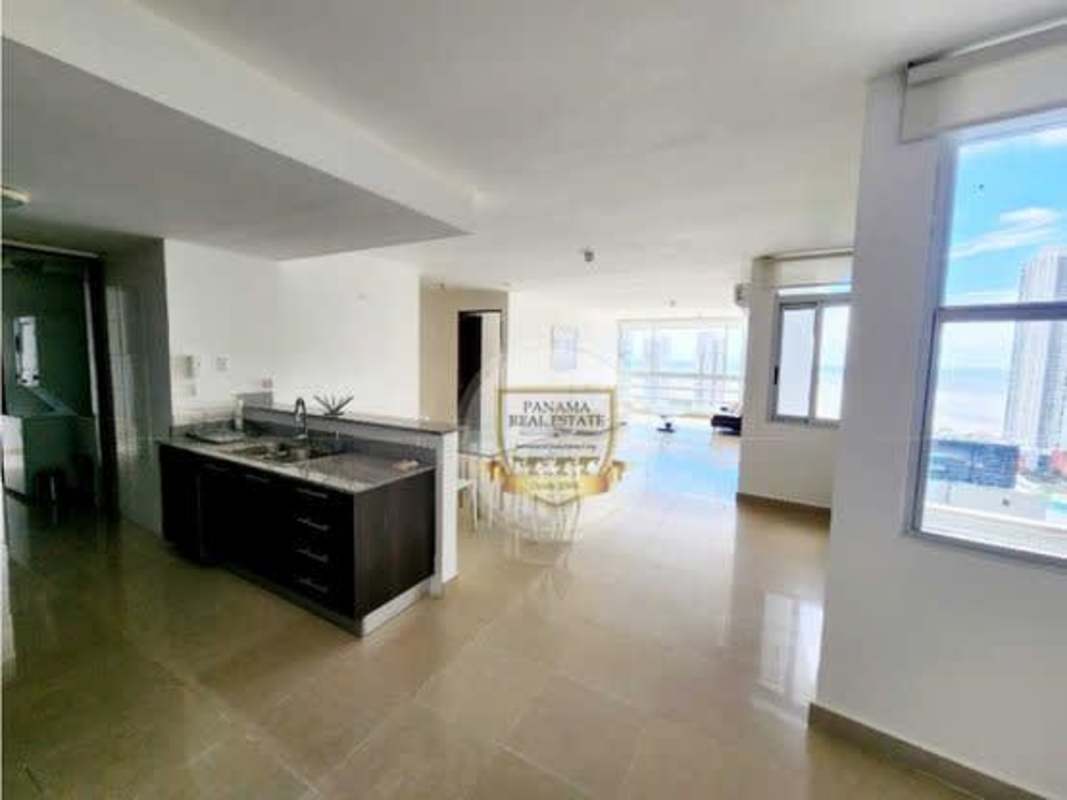 Bright open kitchen and living area with floor-to-ceiling windows Costa del Este Panama
